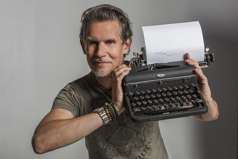 Patrick Combs holding a vintage Royal typewriter