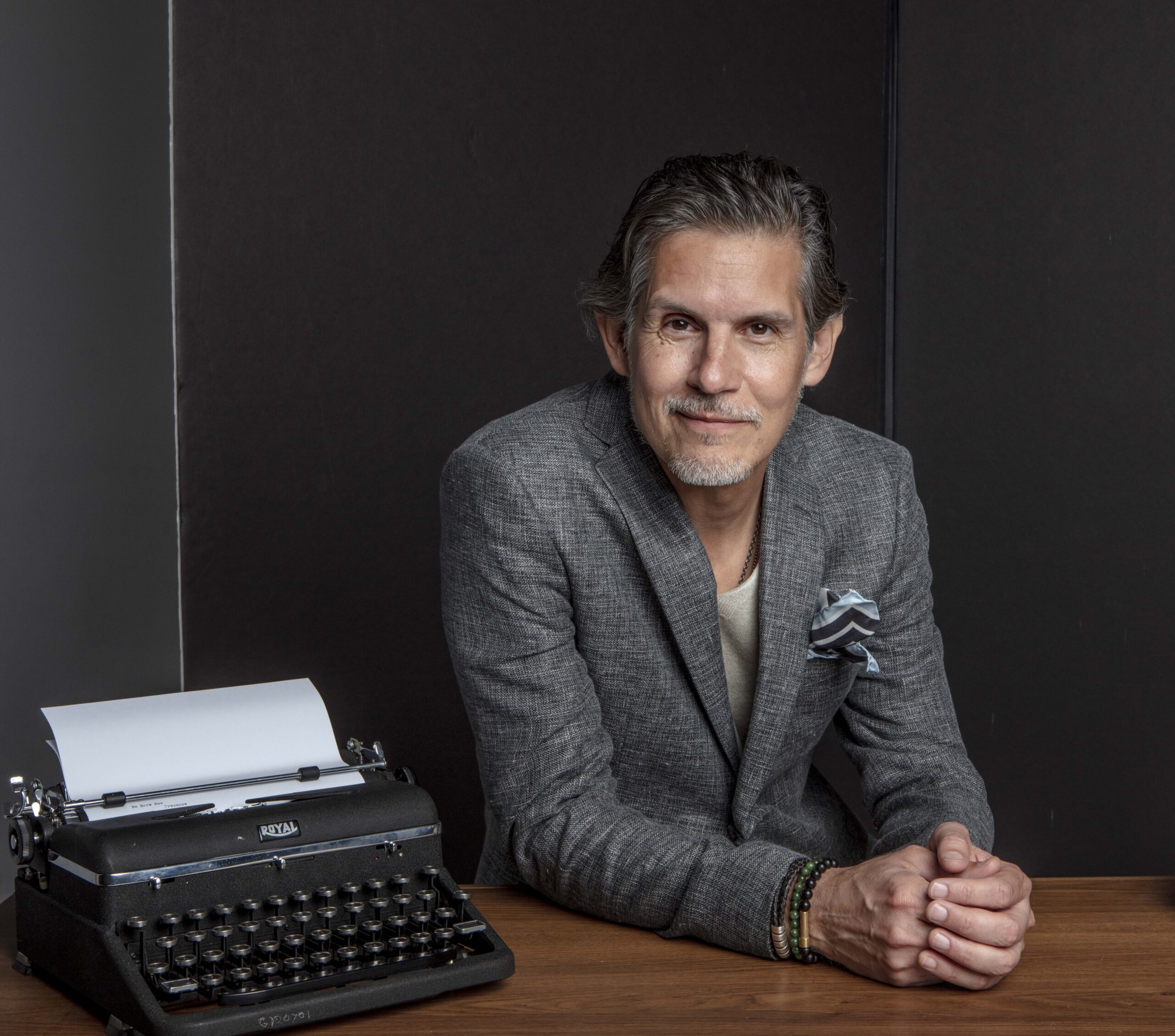 Patrick Combs at typewriter